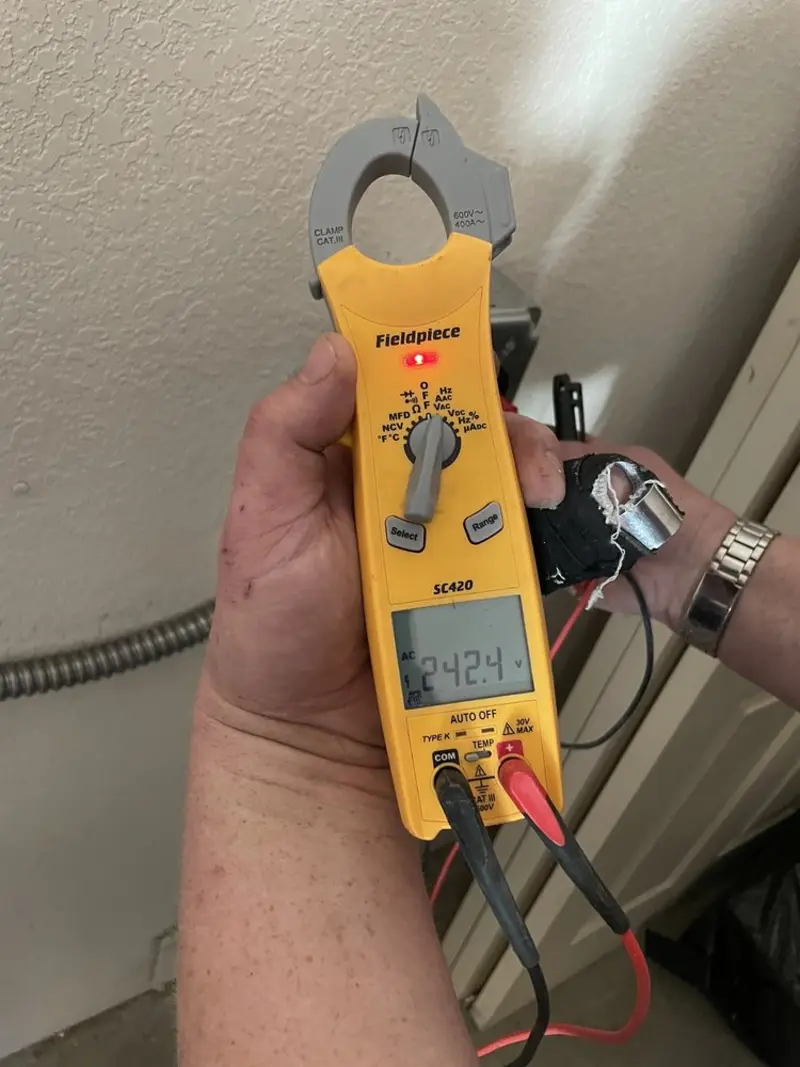 Voltage testing with clamp meter during Outlet Installation in Centralia